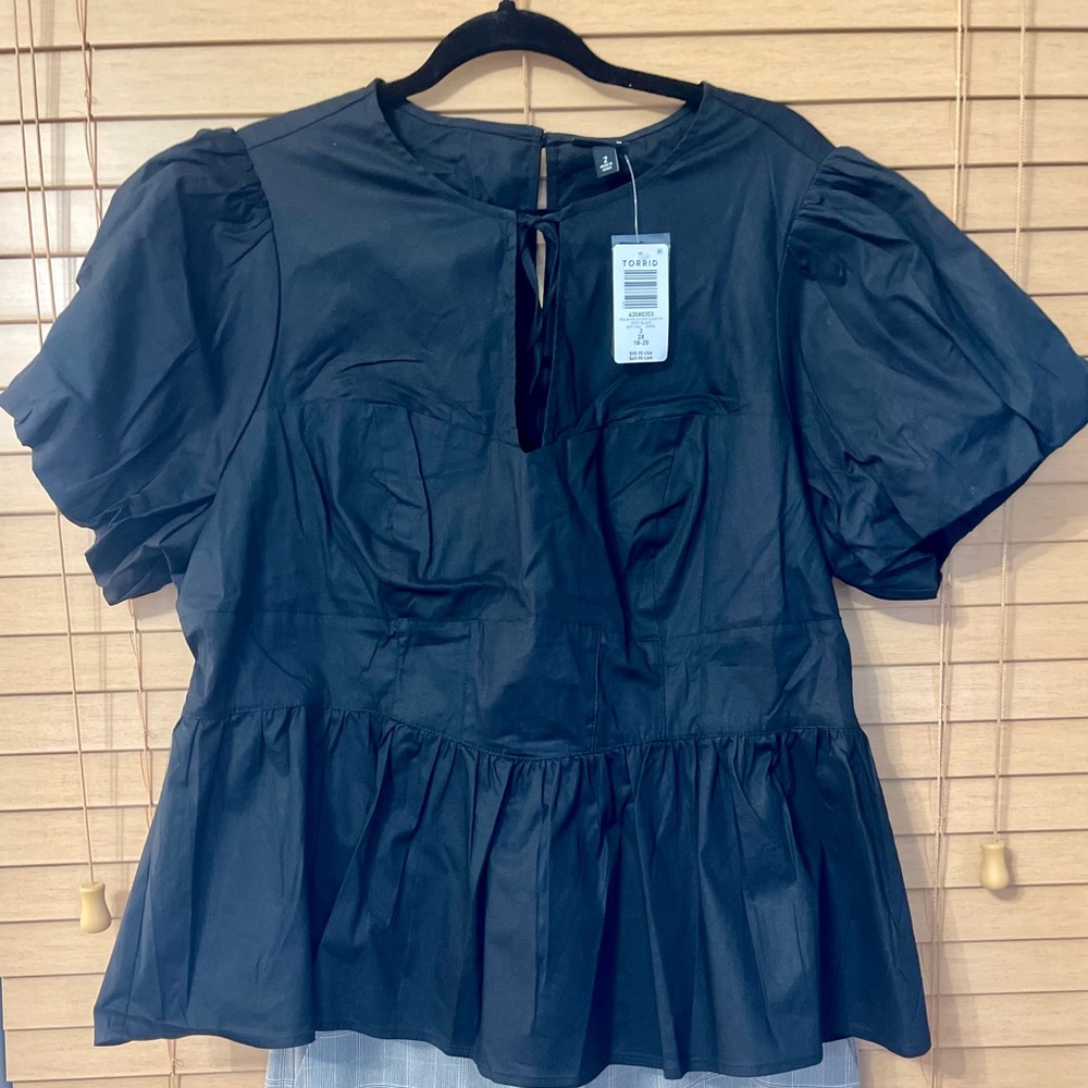 Torrid black peplum top. New with tags